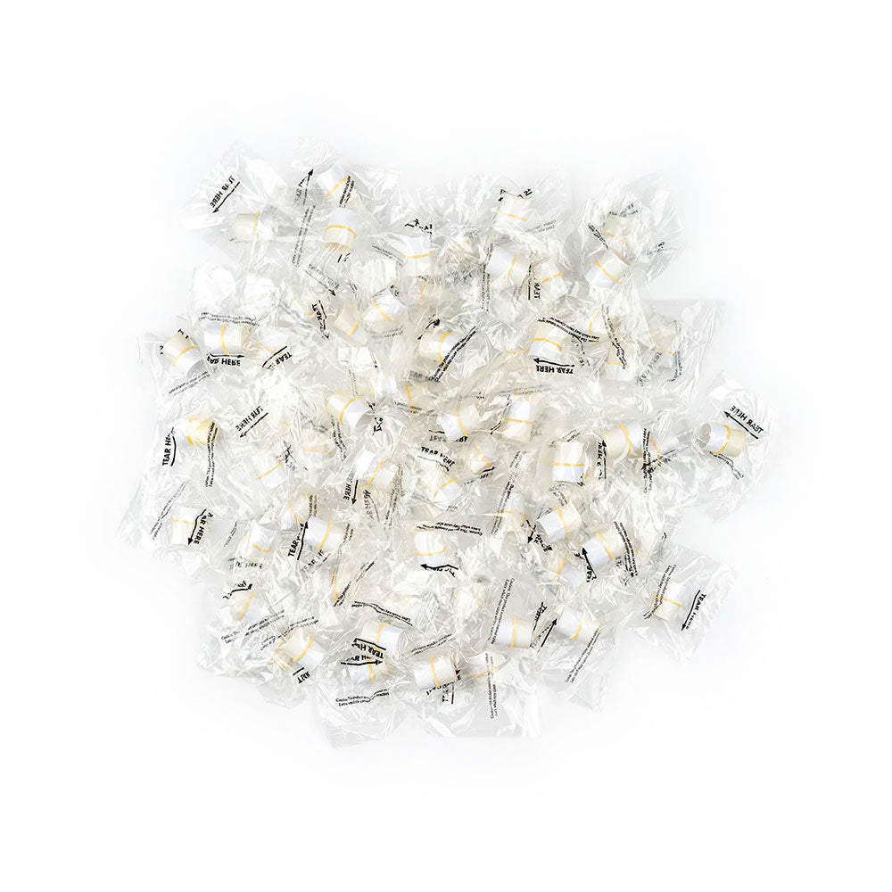 A scattered pile of fortune cookies in clear wrappers, featuring black text, lies on a white background. These wrappers resemble the precision and hygiene of MedPharma USAs Tonometer Tip Covers, Individually Wrapped, 300/Box.