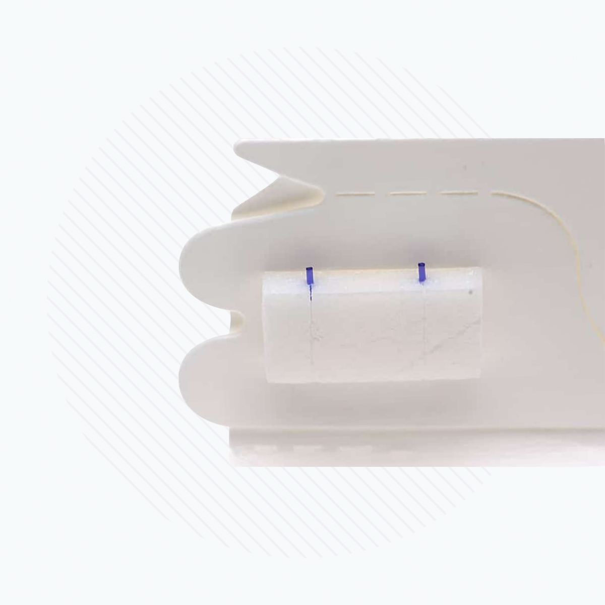 This image features a close-up of a white plastic object with a small rectangular component, akin to Lacriveras Vera180 Synthetic Absorbable Lacrimal Plugs. The background has a light striped pattern, evoking precision typical in dry eye treatment devices.