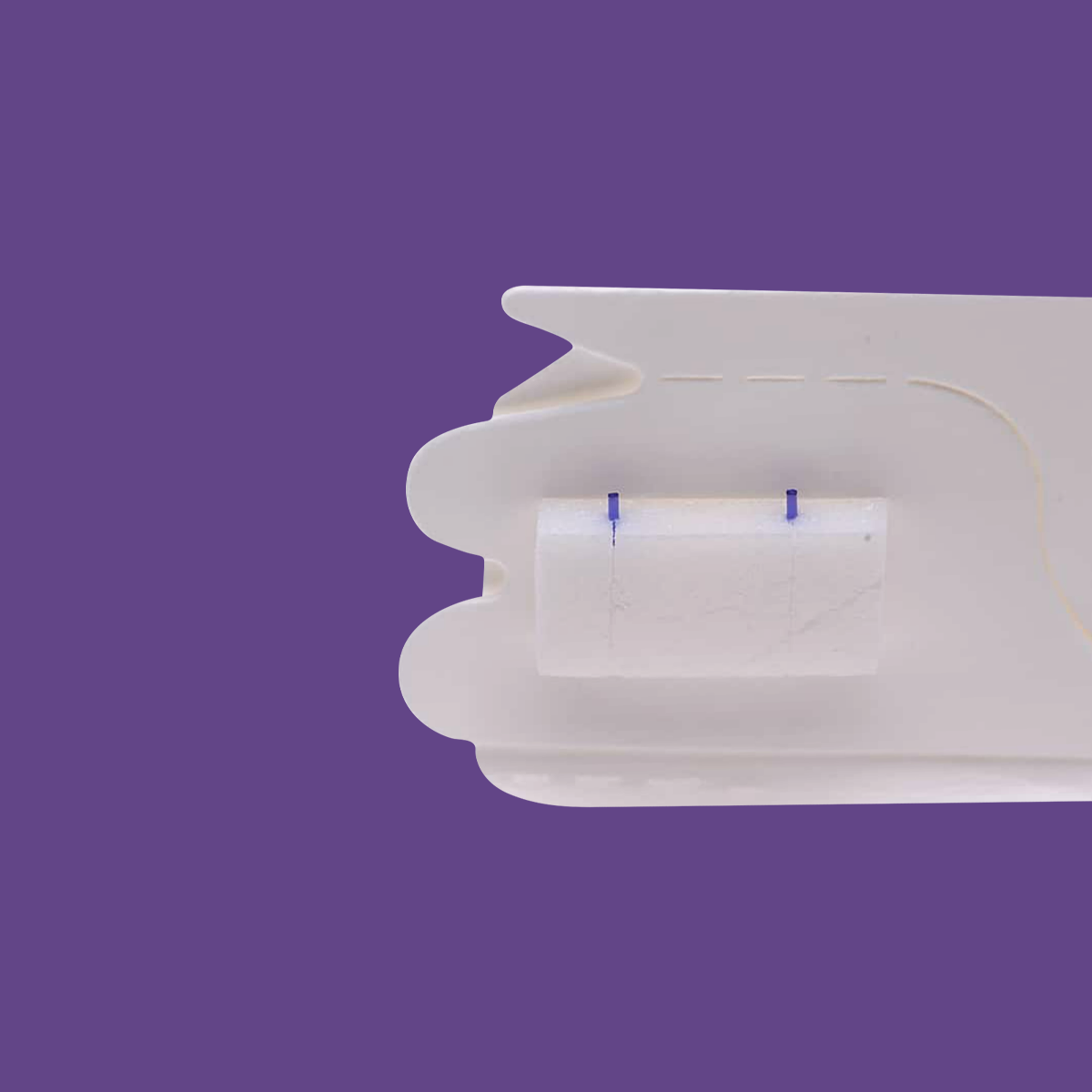 A close-up of a white bandage on a purple background looks like Lacrivera Vera180 Synthetic Absorbable Lacrimal 180 Day Plugs, which are used in dry eye treatment. The bandage is slightly rolled, showing a white gauze pad with two blue lines.