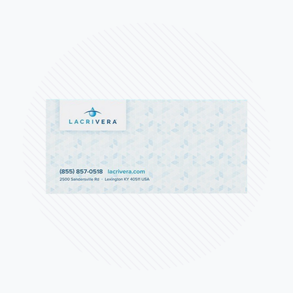 Business card featuring the Lacrivera logo, perfect for dry eye therapy professionals. Includes contact info: phone (855) 857-0518, website lacrivera.com, and address 2500 Sandersville Rd, Lexington, KY 40511. Background adorned with a blue geometric pattern.